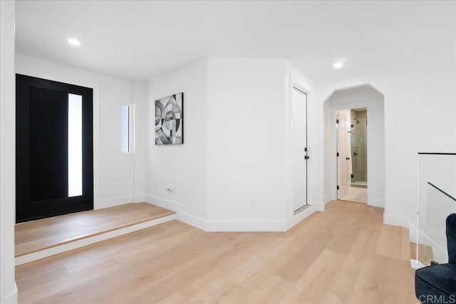 2464 Haller St, San Diego, CA 92104 - foyer with light wood-style floors, baseboards, recessed lighting, and arched walkways