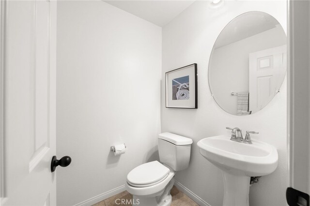 68 Webber Way, Buena Park, CA 90621 - bathroom with baseboards, toilet, and tile patterned floors