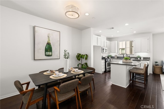 68 Webber Way, Buena Park, CA 90621 - dining space with recessed lighting, dark wood finished floors, and baseboards