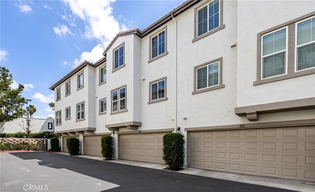 68 Webber Way, Buena Park, CA 90621 - view of property with a garage