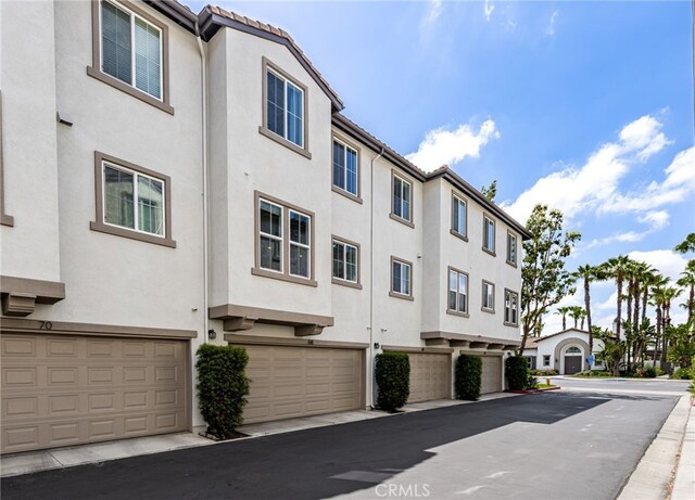 68 Webber Way, Buena Park, CA 90621 - view of building exterior with an attached garage