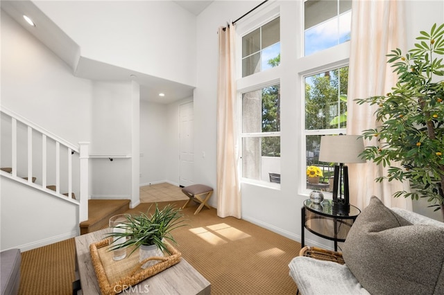 68 Webber Way, Buena Park, CA 90621 - living area with carpet flooring, stairway, baseboards, a high ceiling, and recessed lighting
