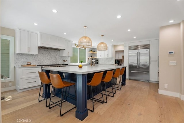 31852 Via Faisan, Coto De Caza, CA 92679 - kitchen with stainless steel appliances, white cabinets, light wood-style flooring, and recessed lighting