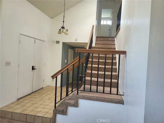 1616 Bluebell St, Lancaster, CA 93535 - staircase with vaulted ceiling and tile patterned flooring