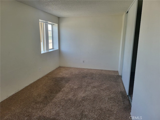 1616 Bluebell St, Lancaster, CA 93535 - carpeted empty room with a textured ceiling