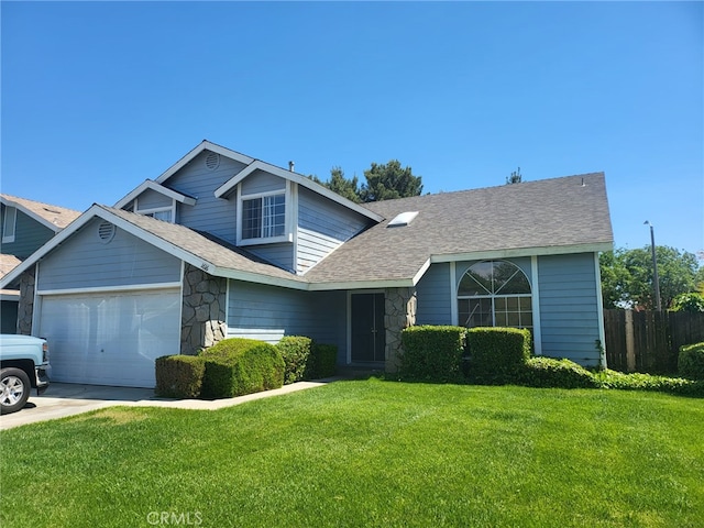 1616 Bluebell St, Lancaster, CA 93535 - traditional-style home with stone siding, an attached garage, concrete driveway, and roof with shingles