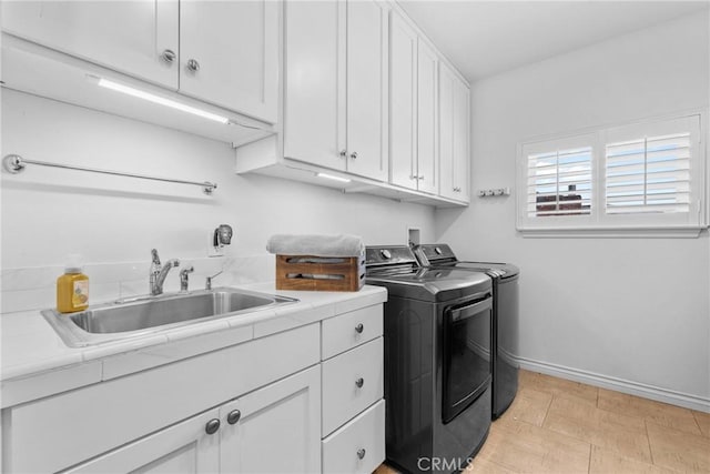 1271 N Tulare Way, Upland, CA 91786 - laundry room with washing machine and dryer, cabinet space, and baseboards