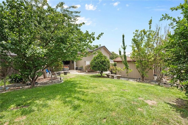 1271 N Tulare Way, Upland, CA 91786 - view of grassy yard with a patio and an outbuilding