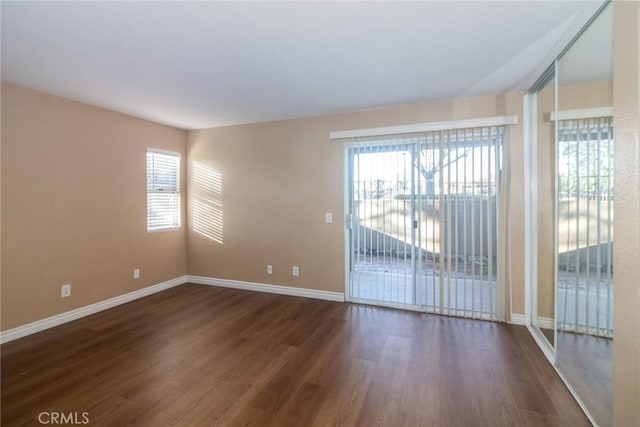 200 E Alessandro Blvd Unit 97, Riverside, CA 92508 - spare room featuring dark wood-style floors, baseboards, and plenty of natural light