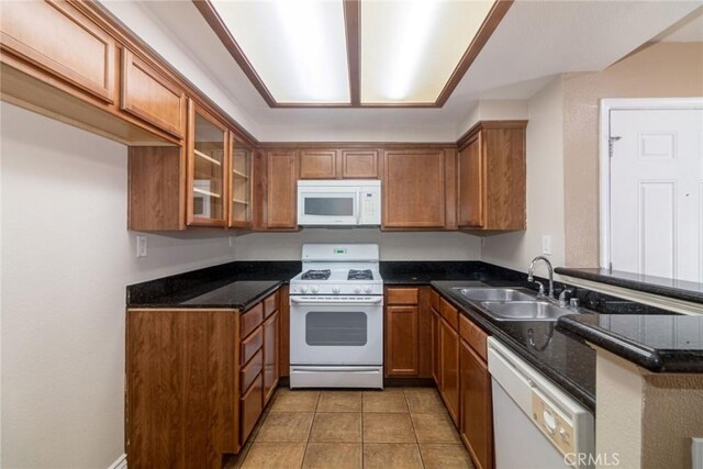 200 E Alessandro Blvd Unit 97, Riverside, CA 92508 - kitchen with white appliances, brown cabinets, a sink, and glass insert cabinets