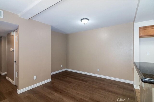 200 E Alessandro Blvd Unit 97, Riverside, CA 92508 - spare room with dark wood-type flooring and baseboards