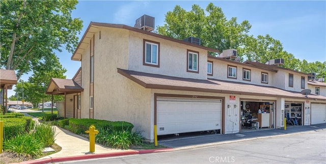 2142 S Mountain Ave, Ontario, CA 91762 - townhome / multi-family property featuring stucco siding and an attached garage