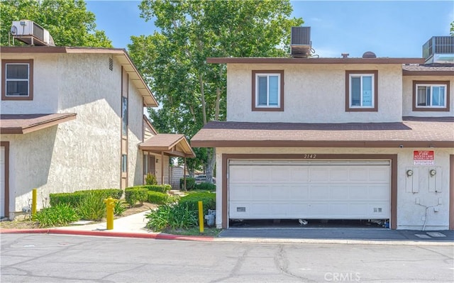 2142 S Mountain Ave, Ontario, CA 91762 - view of property featuring stucco siding and central air condition unit