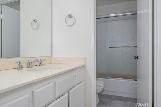 2142 S Mountain Ave, Ontario, CA 91762 - full bathroom featuring vanity, tile patterned floors, and bath / shower combo with glass door