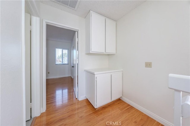 2142 S Mountain Ave, Ontario, CA 91762 - hallway featuring light wood-style flooring and baseboards