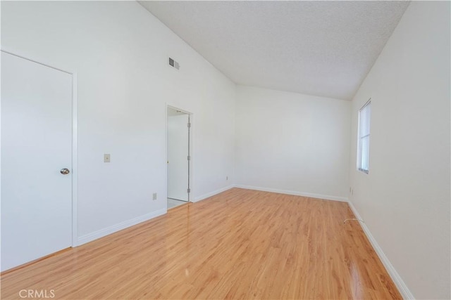 2142 S Mountain Ave, Ontario, CA 91762 - unfurnished bedroom with light wood finished floors and lofted ceiling