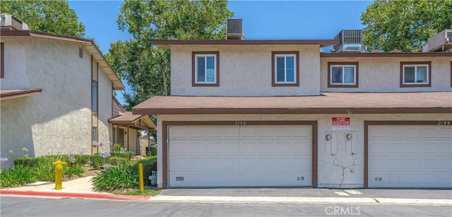 2142 S Mountain Ave, Ontario, CA 91762 - view of front of home featuring an attached garage and stucco siding