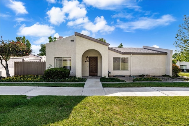 mediterranean / spanish house with stucco siding