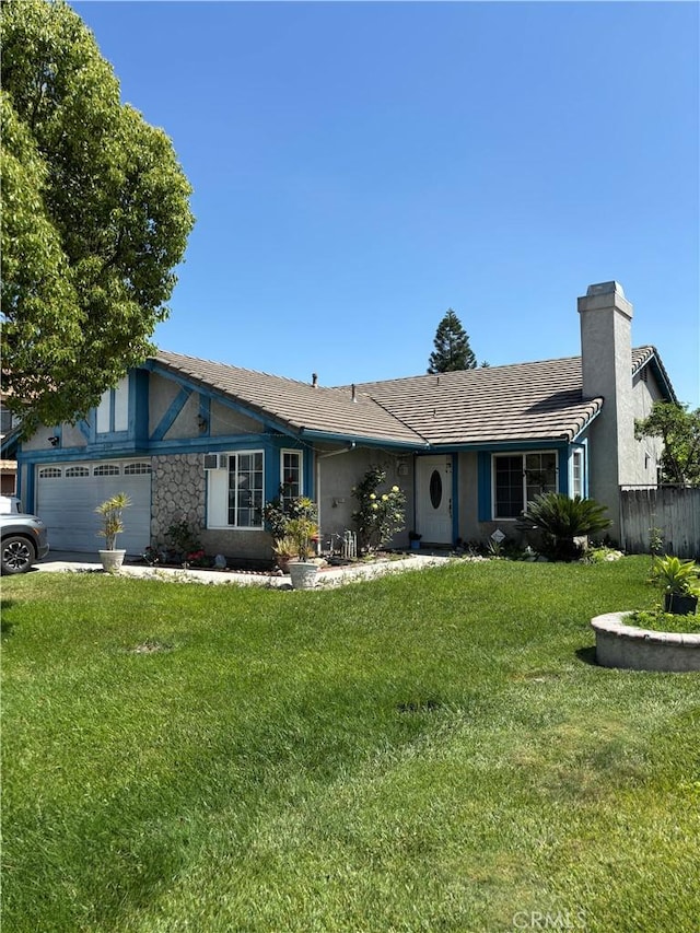 2869 Rosarita St, San Bernardino, CA 92407 - view of front facade featuring a chimney, an attached garage, and stucco siding