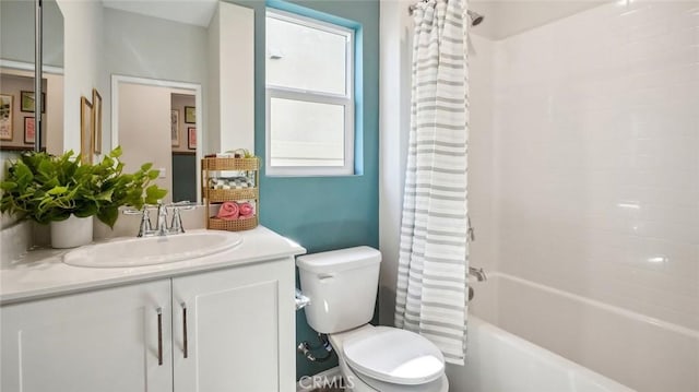 bathroom featuring toilet, vanity, and shower / bath combo with shower curtain