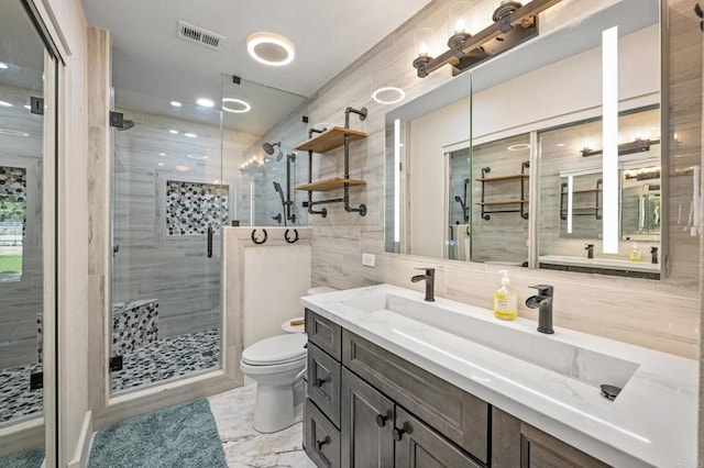 17985 Copper Queen Ln, Perris, CA 92570 - bathroom featuring toilet, a stall shower, marble finish flooring, vanity, and tile walls