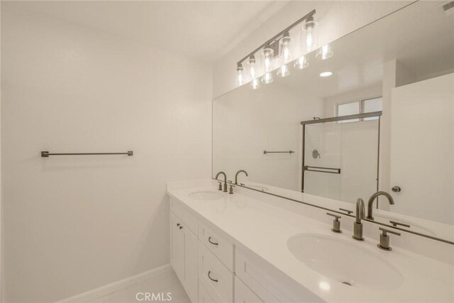 21918 Mohican Ave, Apple Valley, CA 92307 - full bathroom with double vanity and a stall shower