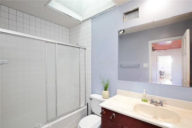 5408 Whitewood Ave, Lakewood, CA 90712 - full bath featuring vanity, toilet, a ceiling fan, and shower / bath combination with glass door