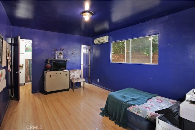 5408 Whitewood Ave, Lakewood, CA 90712 - bedroom with a wall unit AC and wood finished floors