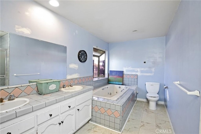 5408 Whitewood Ave, Lakewood, CA 90712 - bathroom with marble look tile flooring, a jetted tub, toilet, double vanity, and baseboards