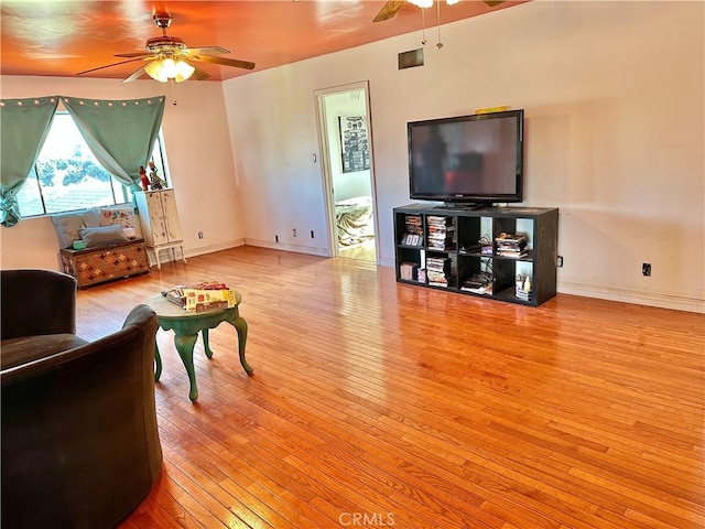 5408 Whitewood Ave, Lakewood, CA 90712 - living area featuring a ceiling fan, hardwood / wood-style floors, and baseboards