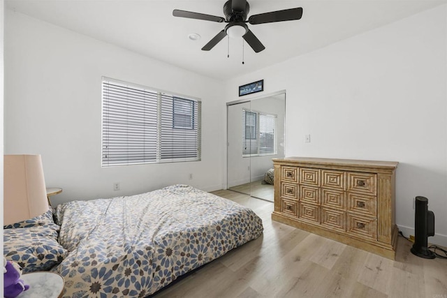 425961 Maryland St, San Diego, CA 92103 - bedroom with light wood-type flooring, a ceiling fan, a closet, and baseboards