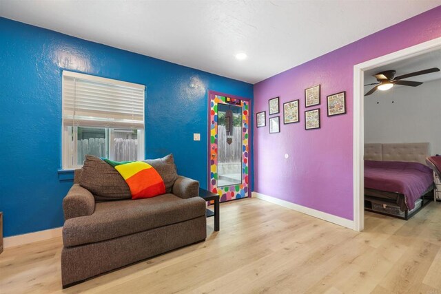 425961 Maryland St, San Diego, CA 92103 - sitting room featuring a textured wall, wood finished floors, ceiling fan, baseboards, and recessed lighting
