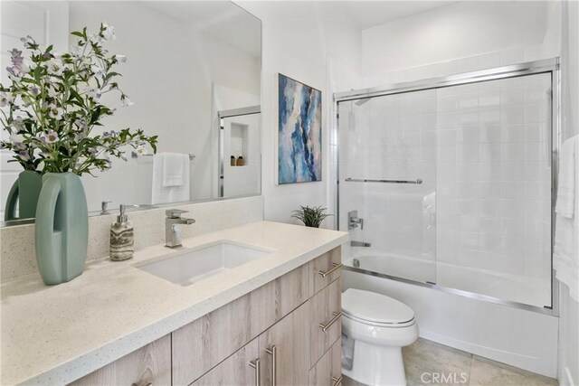 59 Dorado, Irvine, CA 92618 - bathroom featuring vanity, toilet, enclosed tub / shower combo, and tile patterned flooring