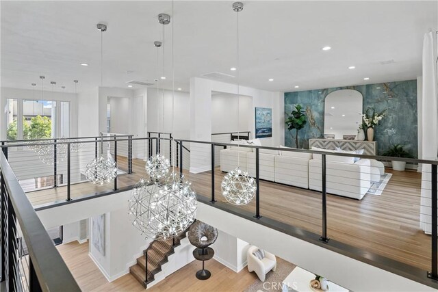 59 Dorado, Irvine, CA 92618 - hall with an upstairs landing, wood finished floors, recessed lighting, and a chandelier