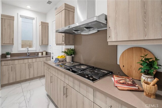 59 Dorado, Irvine, CA 92618 - kitchen featuring light brown cabinetry, wall chimney range hood, a sink, and recessed lighting