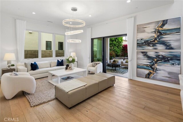 59 Dorado, Irvine, CA 92618 - living area with light wood-type flooring, recessed lighting, and a chandelier