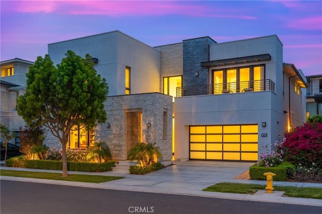 59 Dorado, Irvine, CA 92618 - contemporary house with a balcony, driveway, stone siding, a garage, and stucco siding