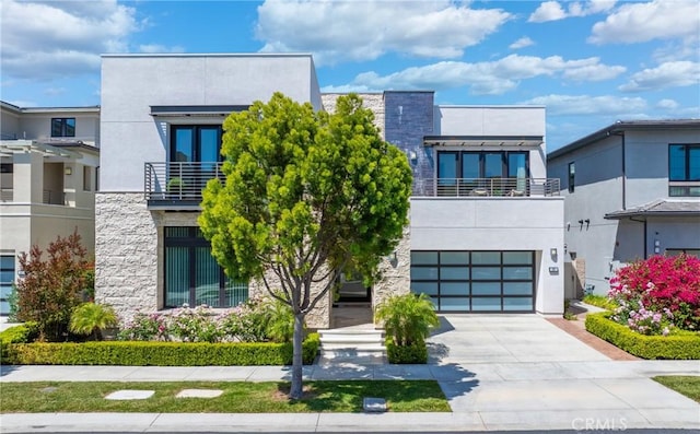 59 Dorado, Irvine, CA 92618 - contemporary home featuring stone siding, driveway, stucco siding, and an attached garage
