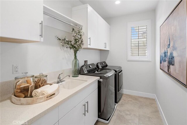 59 Dorado, Irvine, CA 92618 - laundry room with independent washer and dryer, cabinet space, baseboards, and recessed lighting