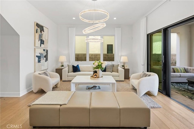 59 Dorado, Irvine, CA 92618 - living room with a chandelier, light wood-style flooring, baseboards, and recessed lighting