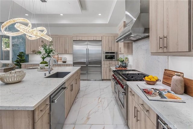 59 Dorado, Irvine, CA 92618 - kitchen featuring high quality appliances, wall chimney exhaust hood, light brown cabinets, and recessed lighting