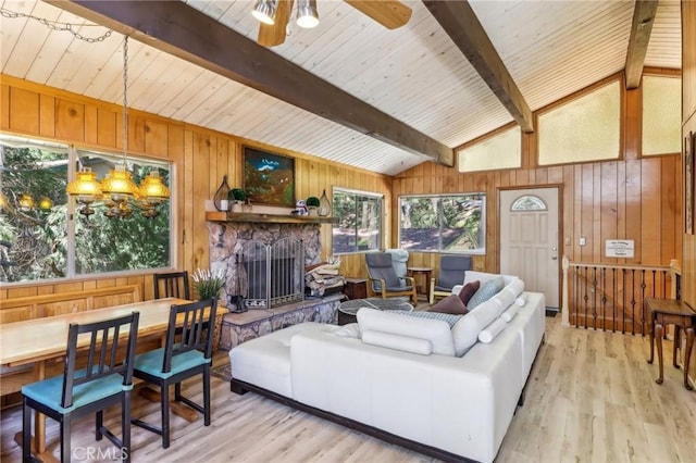 24514 Albrun Dr, Crestline, CA 92325 - living room with wooden walls, light wood-type flooring, a ceiling fan, wood ceiling, and a fireplace