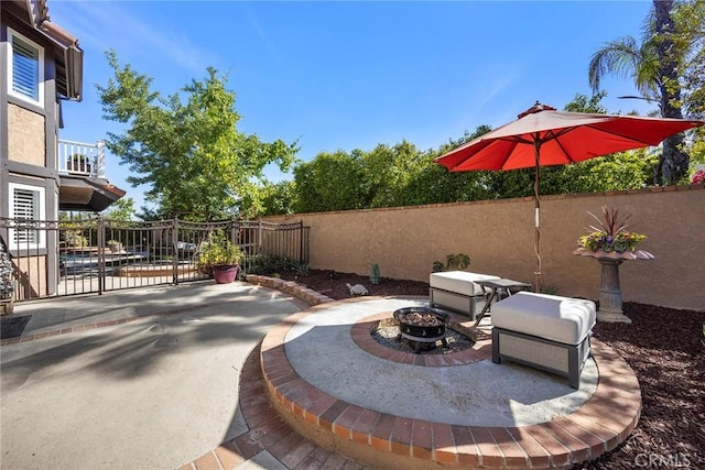 5034 Vista Montana, Yorba Linda, CA 92886 - view of patio featuring a fire pit, fence, and a gate