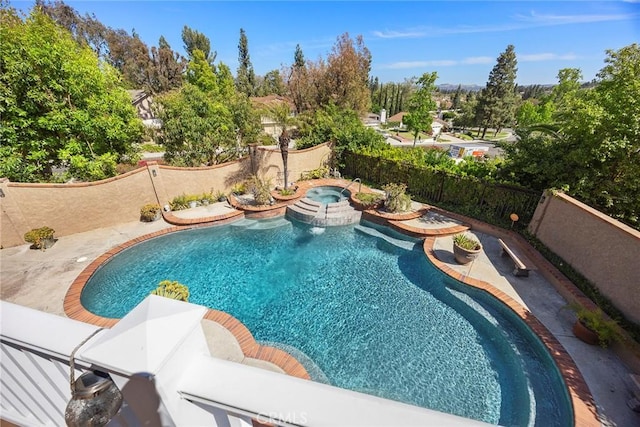 5034 Vista Montana, Yorba Linda, CA 92886 - view of pool featuring fence, a pool with connected hot tub, and view of wooded area
