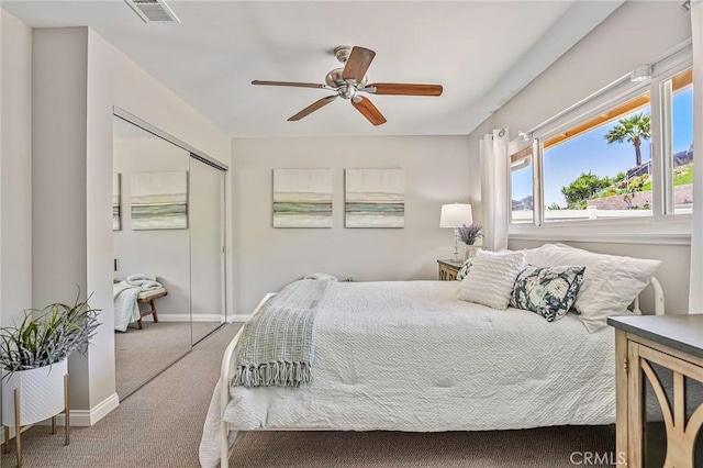 12488 Mantilla Rd, San Diego, CA 92128 - bedroom with carpet floors, a closet, baseboards, and a ceiling fan