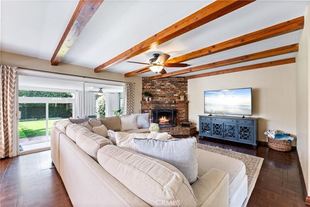 2618 N Louise St, Santa Ana, CA 92706 - living area featuring a ceiling fan, beamed ceiling, a brick fireplace, and dark wood finished floors