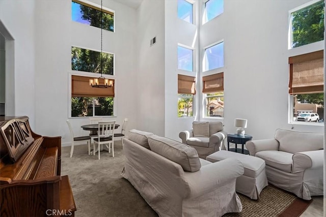 28335 Arroyo Ct, Castaic, CA 91384 - carpeted living room featuring a chandelier, plenty of natural light, and a high ceiling