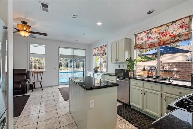 28335 Arroyo Ct, Castaic, CA 91384 - kitchen with dishwasher, a center island, a ceiling fan, a sink, and light tile patterned floors