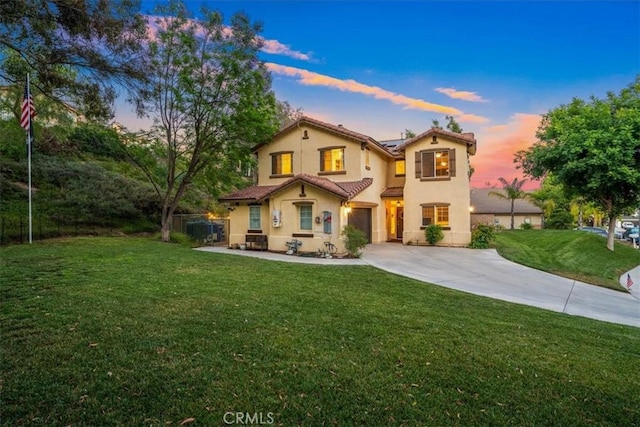 28335 Arroyo Ct, Castaic, CA 91384 - mediterranean / spanish home with concrete driveway, stucco siding, an attached garage, solar panels, and a tile roof