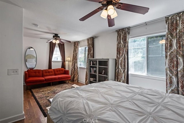 28335 Arroyo Ct, Castaic, CA 91384 - bedroom with wood finished floors, multiple windows, a ceiling fan, and baseboards
